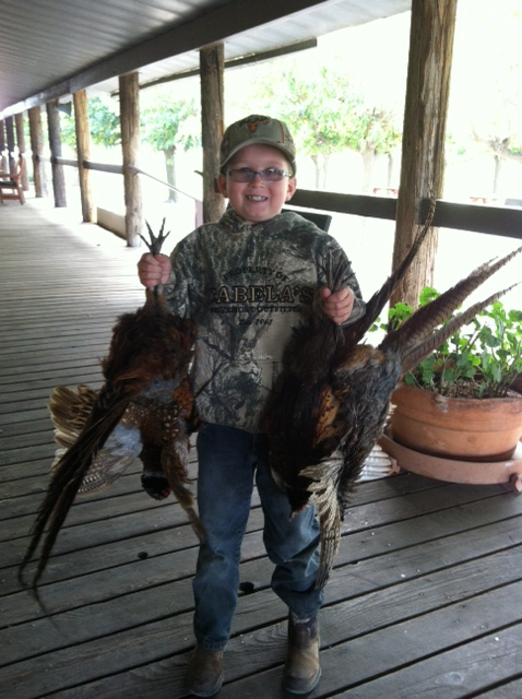 Caiden Hunter 8 years old. Parents Mike & Amy Hunter.  Bringing in his bounty.